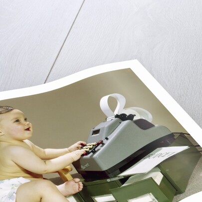 1960s Smiling Accountant Office Worker Baby Wearing Cloth Diaper Sitting In Chair Using Adding Machine Calculator by Anonymous