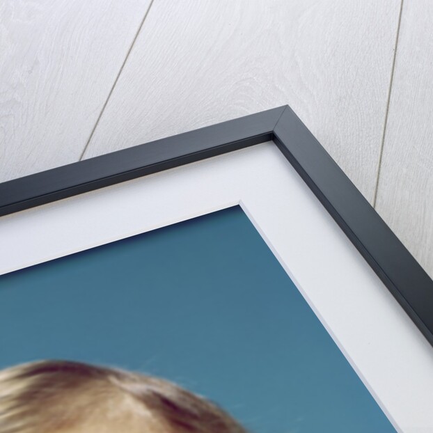 1960s Baby With Uncertain Facial Expression Deep Blue Eyes Looking Guilty Up And To The Side by Anonymous