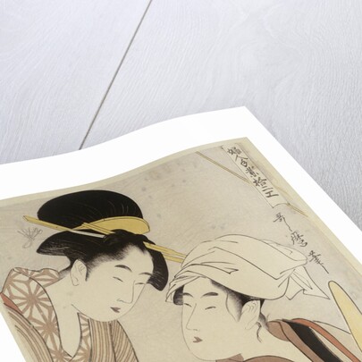 A half-length portrait of two women, one seated at a loom and the other showing a roll of black and white checkered cloth by Kitagawa Utamaro