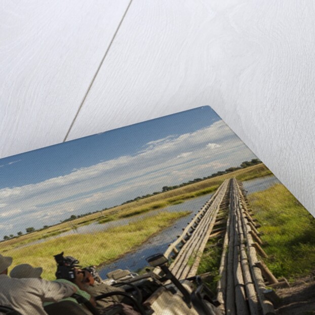 Safari Vehicle Crossing Bridge by Anonymous