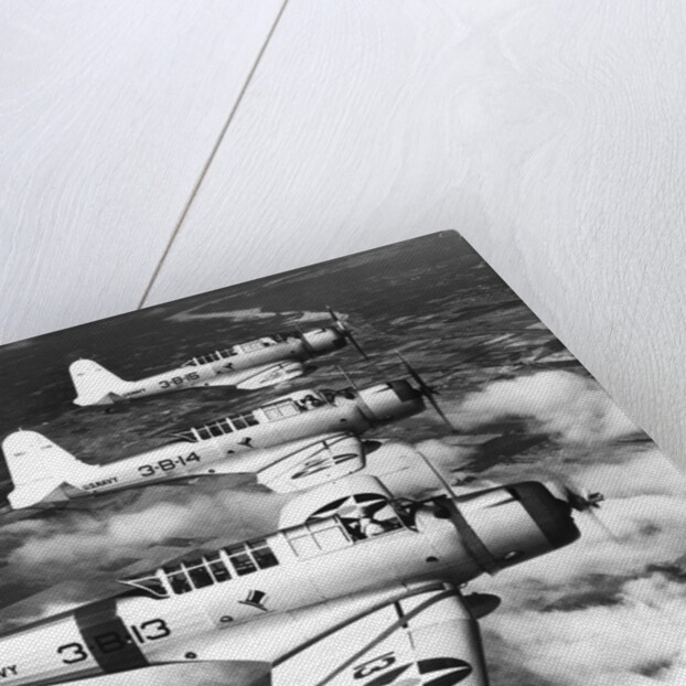 1940s three World War II US navy dive bombers flying in formation by Anonymous