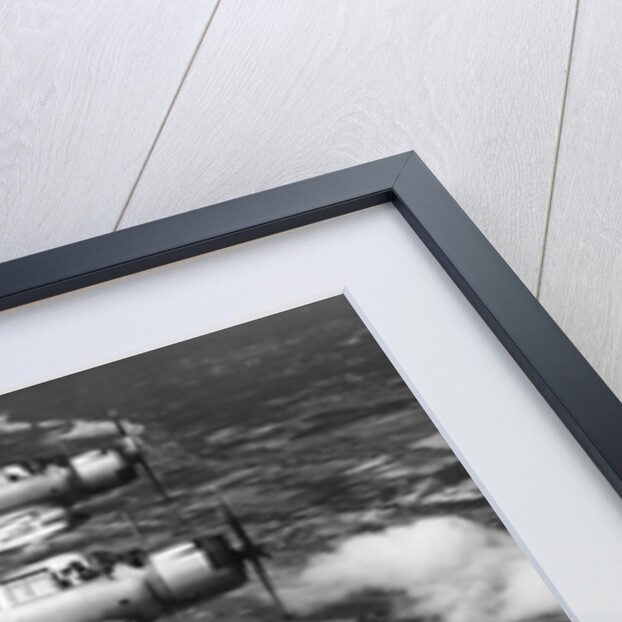 1940s three World War II US navy dive bombers flying in formation by Anonymous