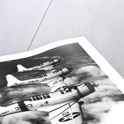 1940s three World War II US navy dive bombers flying in formation by Anonymous