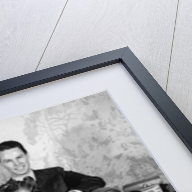 1930s 1940s family of five on a couch by Anonymous