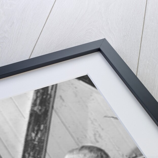 1960s boy and girl sharing a slice of watermelon by Anonymous