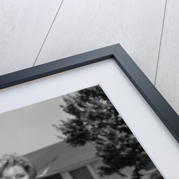 1960s family portrait in front of horse by Anonymous