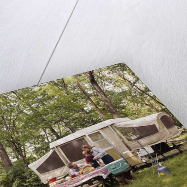 1970s family having picnic by camper by Anonymous