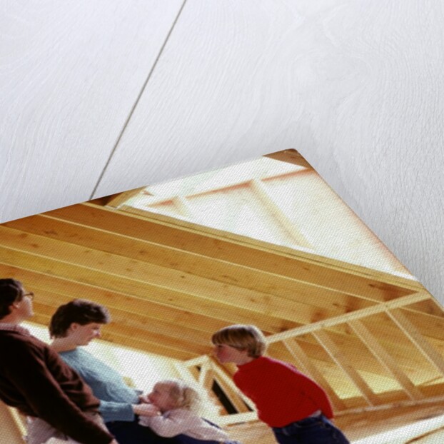1980s family of four inspecting new home under construction by Anonymous