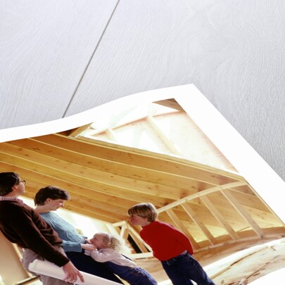 1980s family of four inspecting new home under construction by Anonymous