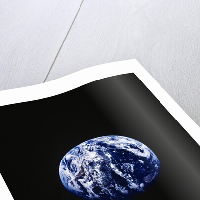 Earth and clock face at 11:57 by Anonymous