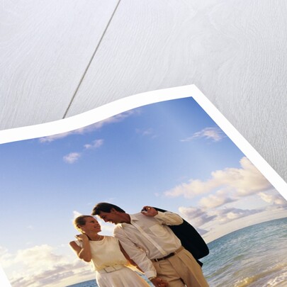 1980s 1990s couple walking on beach by Anonymous