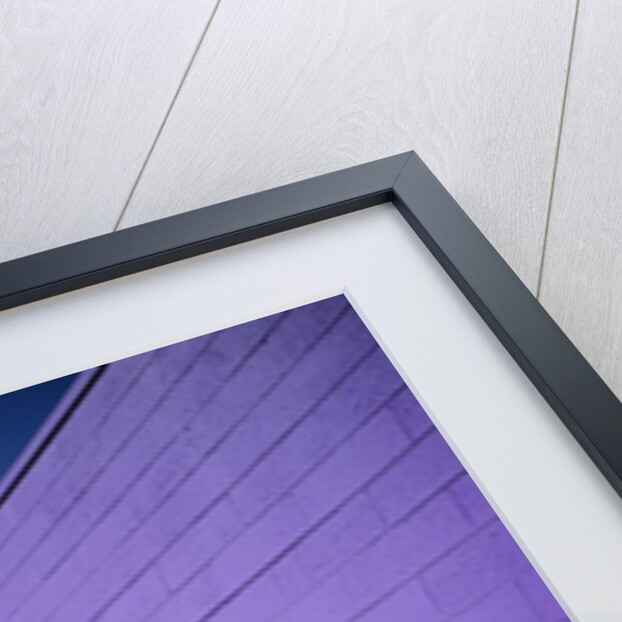 Boy Wearing Roller Blades Jumping Against Wall by Anonymous