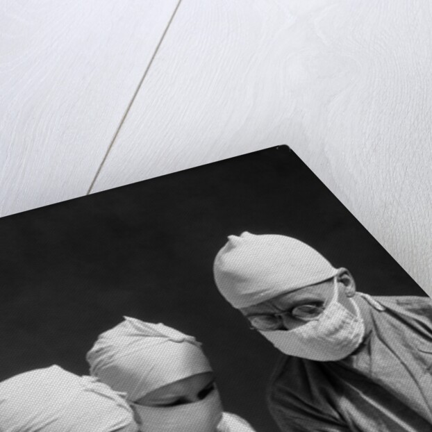 1920s 1930s doctor and two nurses wearing surgical masks by Anonymous