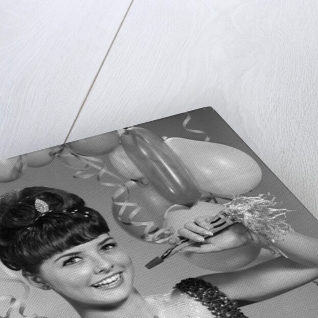 1960s smiling young woman at New Year party by Anonymous