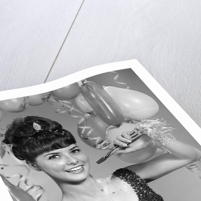 1960s smiling young woman at New Year party by Anonymous