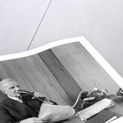 1930s senior executive speaking into a dictaphone by Anonymous