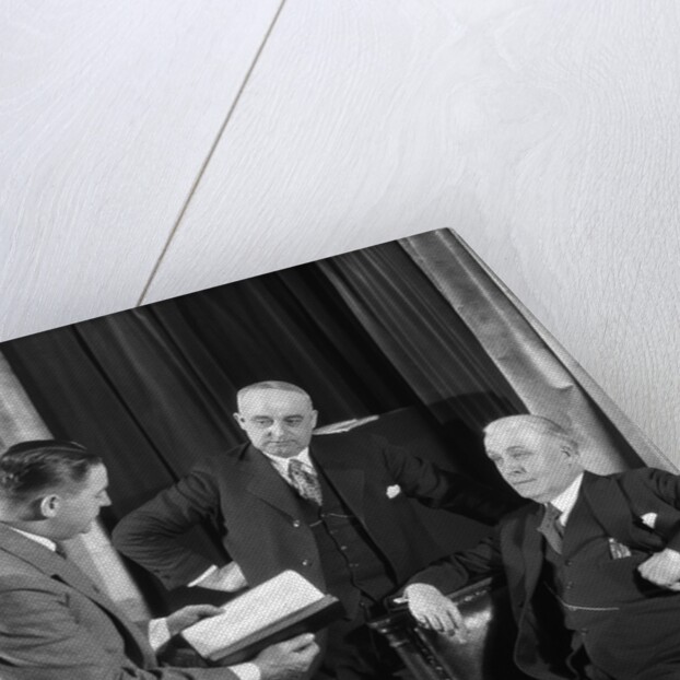 1930s businessmen having a discussion by Anonymous