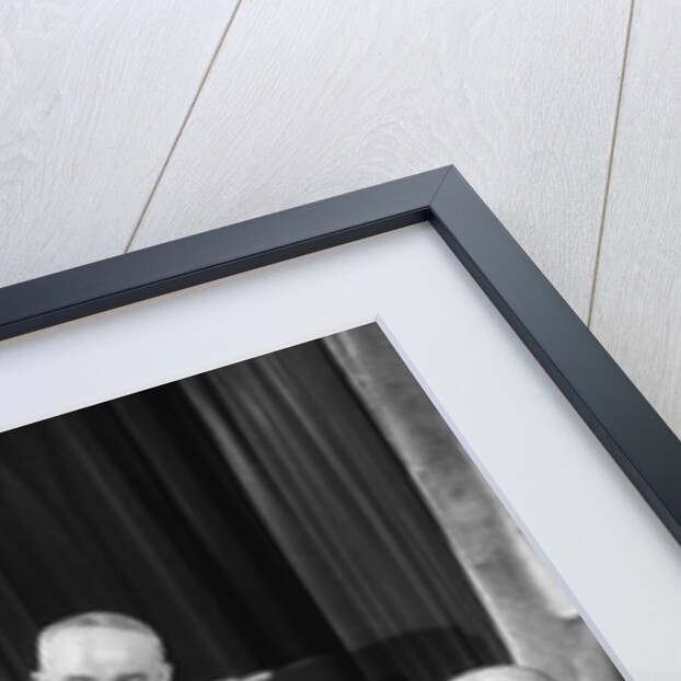 1930s businessmen having a discussion by Anonymous