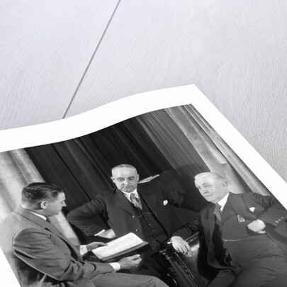 1930s businessmen having a discussion by Anonymous