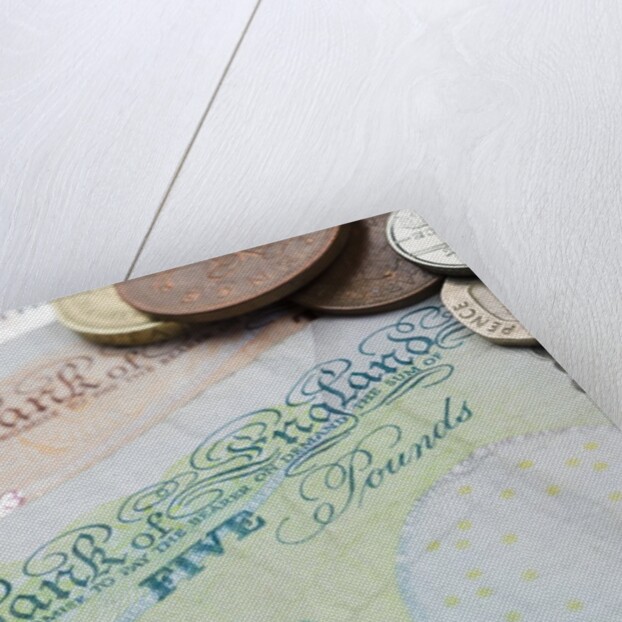 Paper money with change on a table by Anonymous