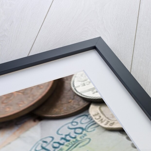 Paper money with change on a table by Anonymous