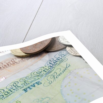 Paper money with change on a table by Anonymous