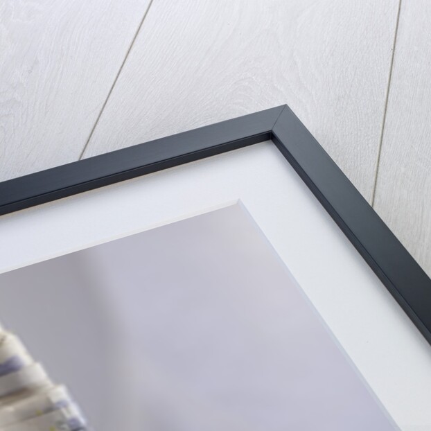 A roll of twenty pound notes on a table by Anonymous