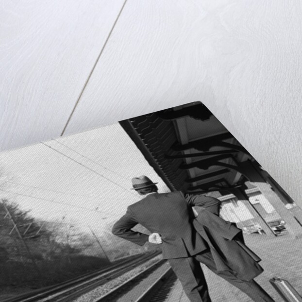 1950s 1960s man waiting for a train by Anonymous