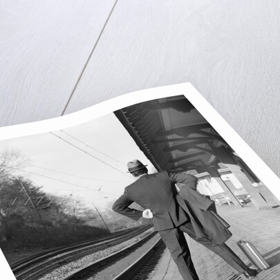 1950s 1960s man waiting for a train by Anonymous