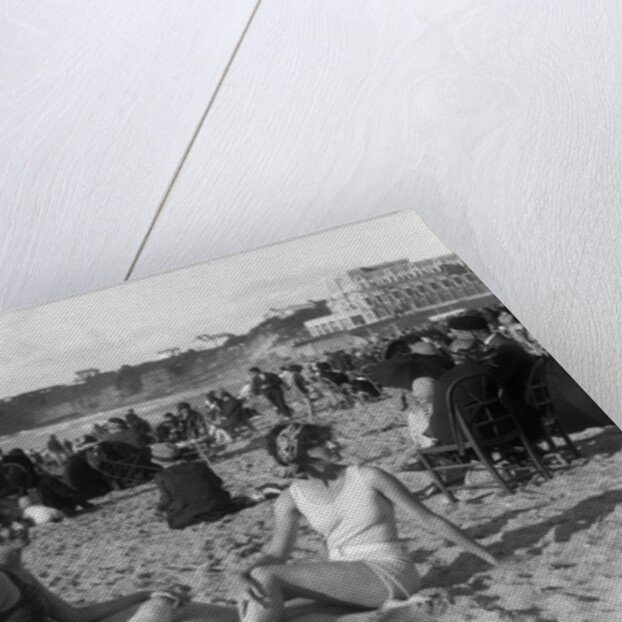 1920s two women sitting on the beach in bathing suits by Anonymous