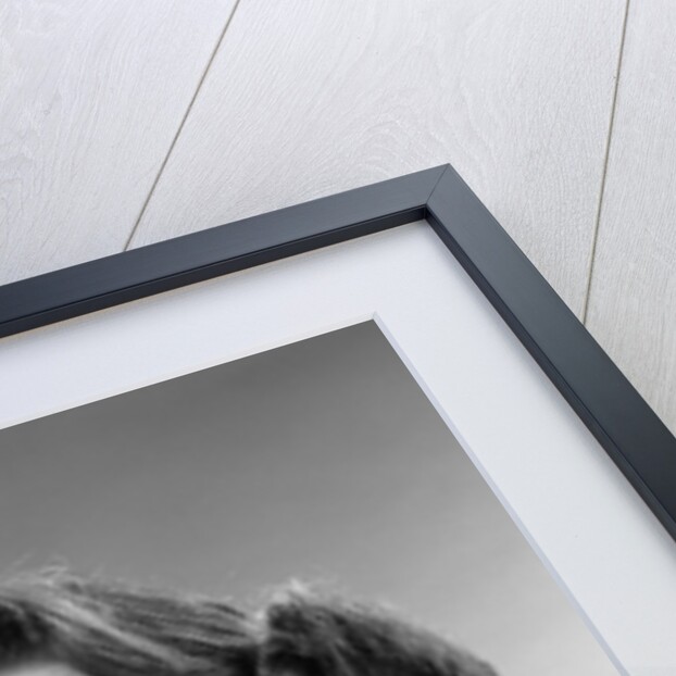 1960s smiling teenage girl listening to portable radio by Anonymous