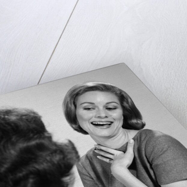 1960s two women talking by Anonymous