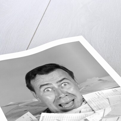 1960s portrait of bug-eyed man buried by bills by Anonymous