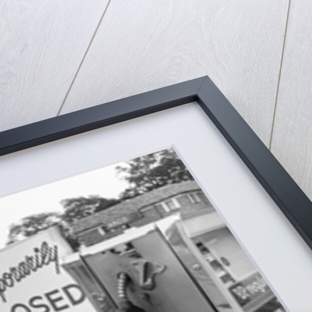 1970s gas pump with temporarily closed sign by Anonymous