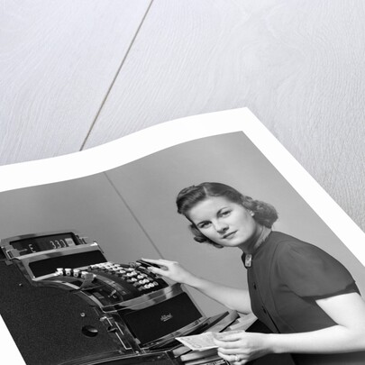1930s 1940s portrait of female sales clerk at a cash register by Anonymous