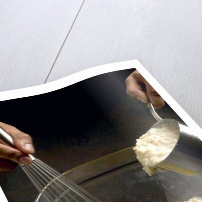 Adding hot rice to egg yolks by Anonymous