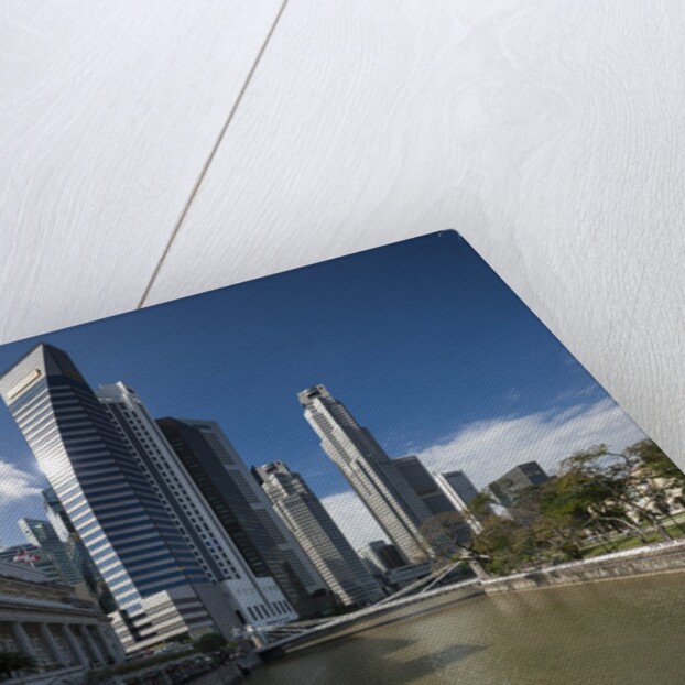Boat on the Singapore river, the Cavenagh Bridge and the downtown by Anonymous