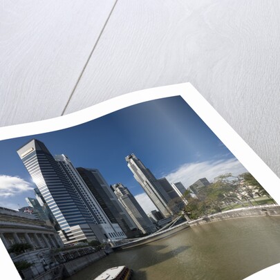 Boat on the Singapore river, the Cavenagh Bridge and the downtown by Anonymous