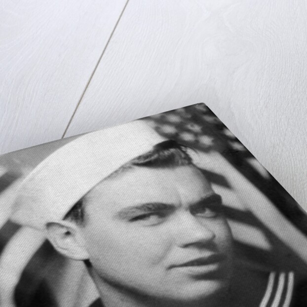 Photo booth portrait of WWII sailor, ca. 1943. by Anonymous