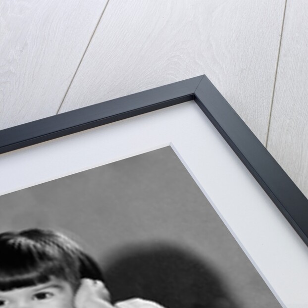 Young girl talks on the phone, ca. 1962. by Anonymous