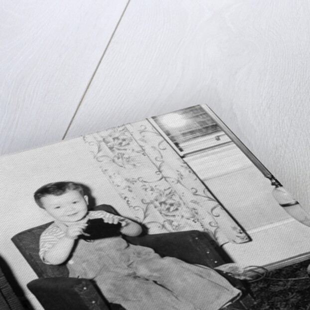 Young boy in his living room, ca. 1946. by Anonymous