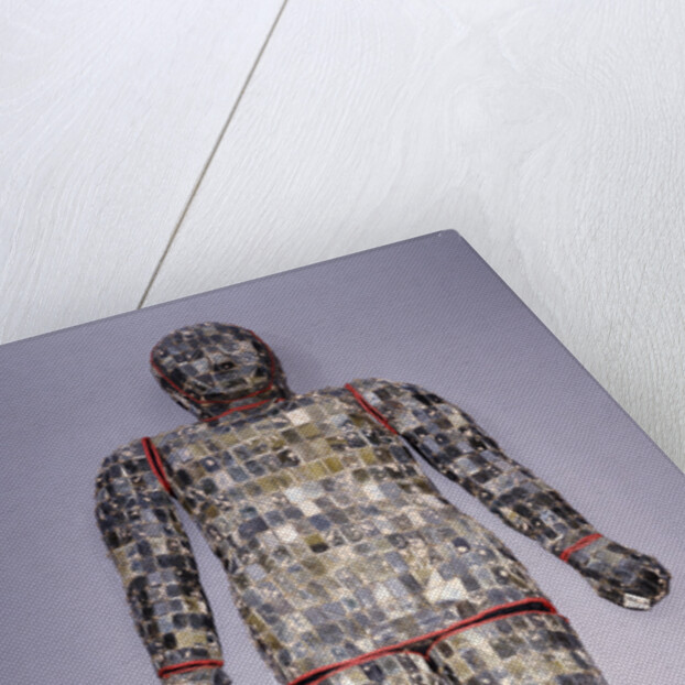 An important archaic spinach green and yellow nephrite jade burial suit assembled in ten sections by Anonymous