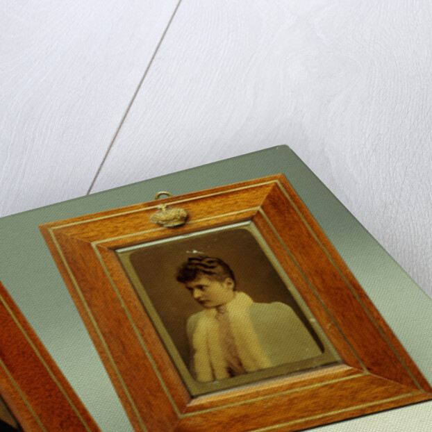 A pair of hand-coloured photos of Tsar Nicholas II & Alexandra and a cylindrical bowentie silver-mounted bell-push, marked Faberge by Anonymous