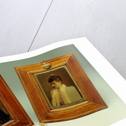 A pair of hand-coloured photos of Tsar Nicholas II & Alexandra and a cylindrical bowentie silver-mounted bell-push, marked Faberge by Anonymous