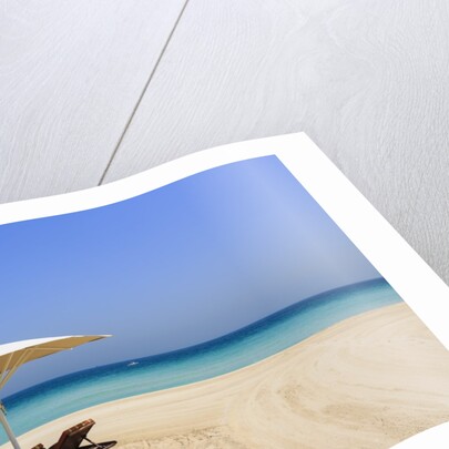 Parasol and recliner on the beach, Dubai by Anonymous