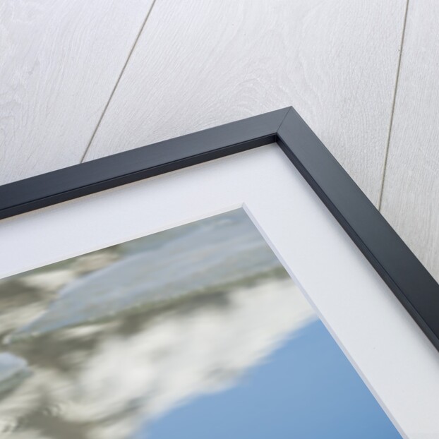 Rock with sky reflected in water. by Anonymous