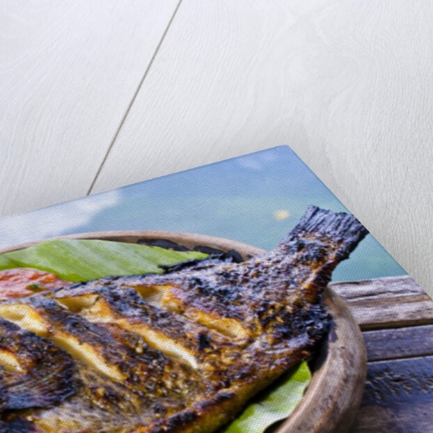 Grilled nila fish, served with banana leave by Anonymous