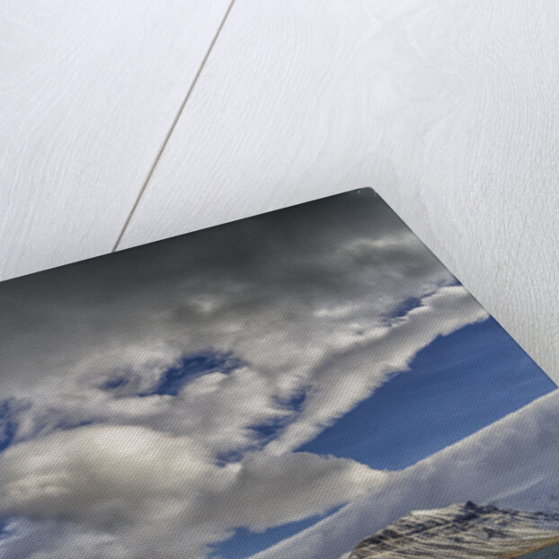 Clouds over fjord in the winter. by Anonymous