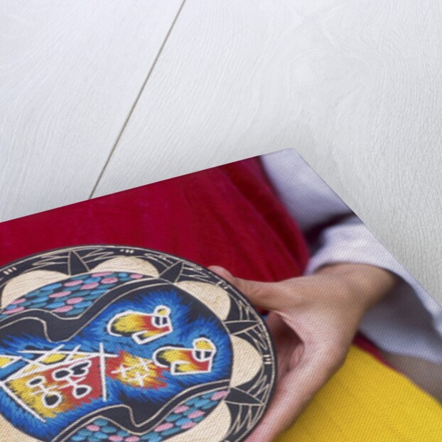 Woman holding wooden plate, China by Anonymous
