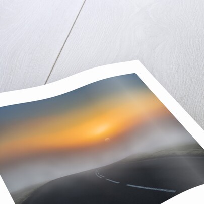 Empty road with fog and sunset. by Anonymous